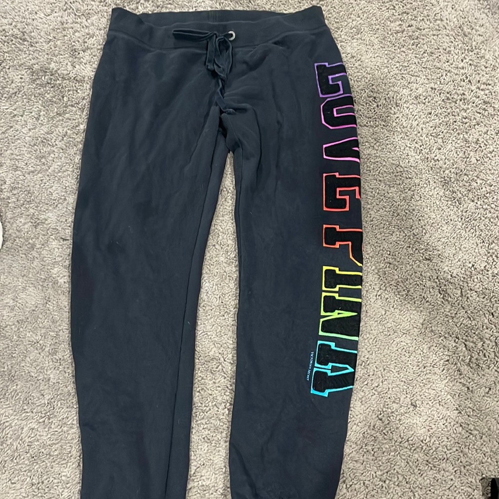 Victoria’s Secret sweatpants.  Home with dogs !